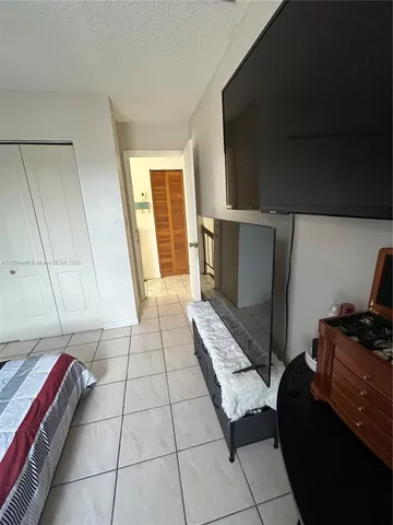 a view of two chairs in the balcony