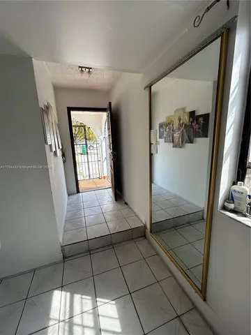 a white refrigerator freezer sitting inside of a kitchen