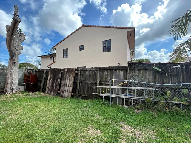 a view of entryway with wooden floor and stairs