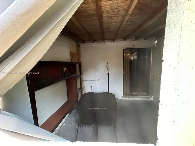 a view of a chairs and table in a room