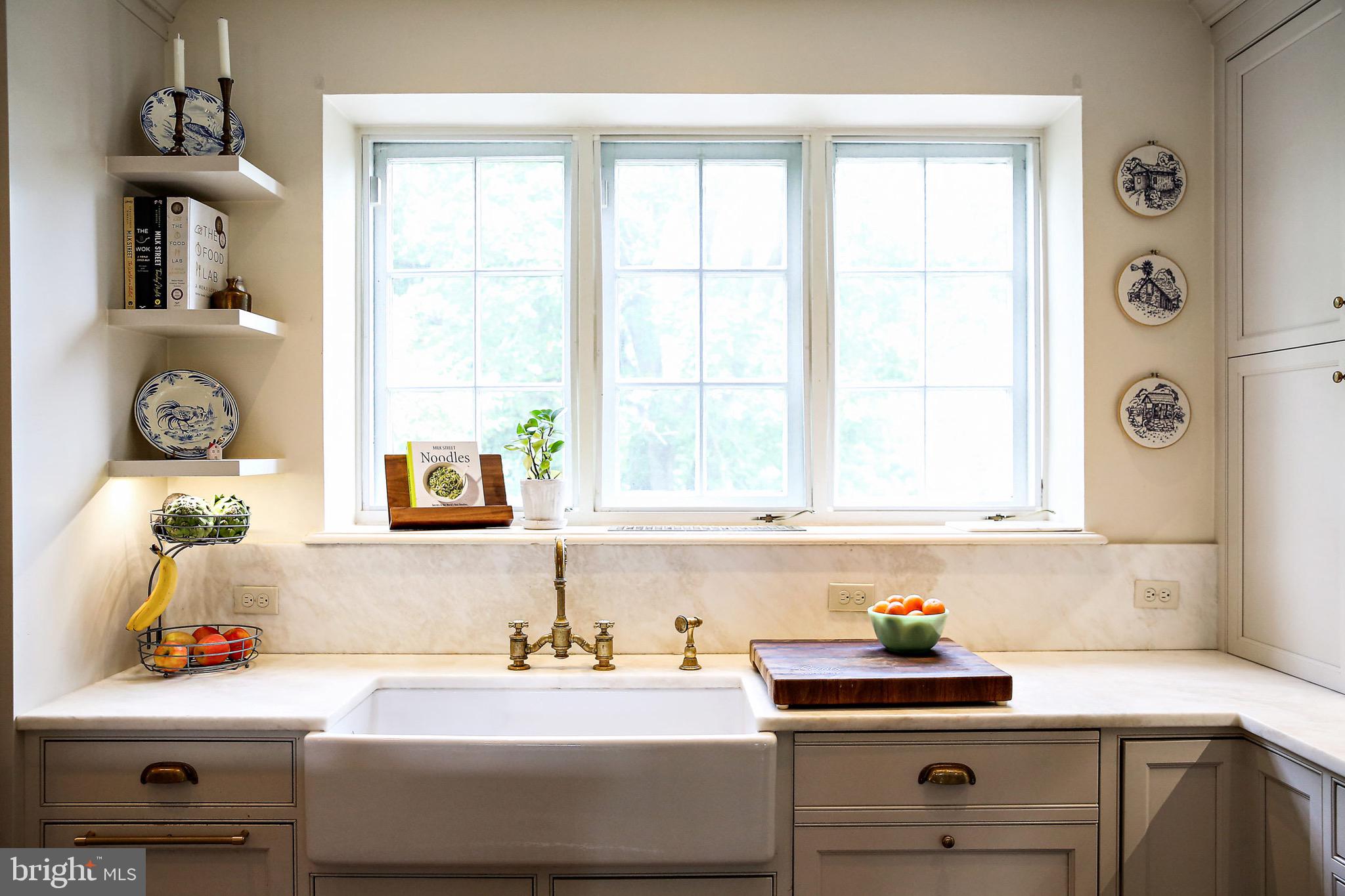 900 Army Road Baltimore, MD 21204 - Photo 17 of 99 A deep farmhouse sink with solid brass fixtures