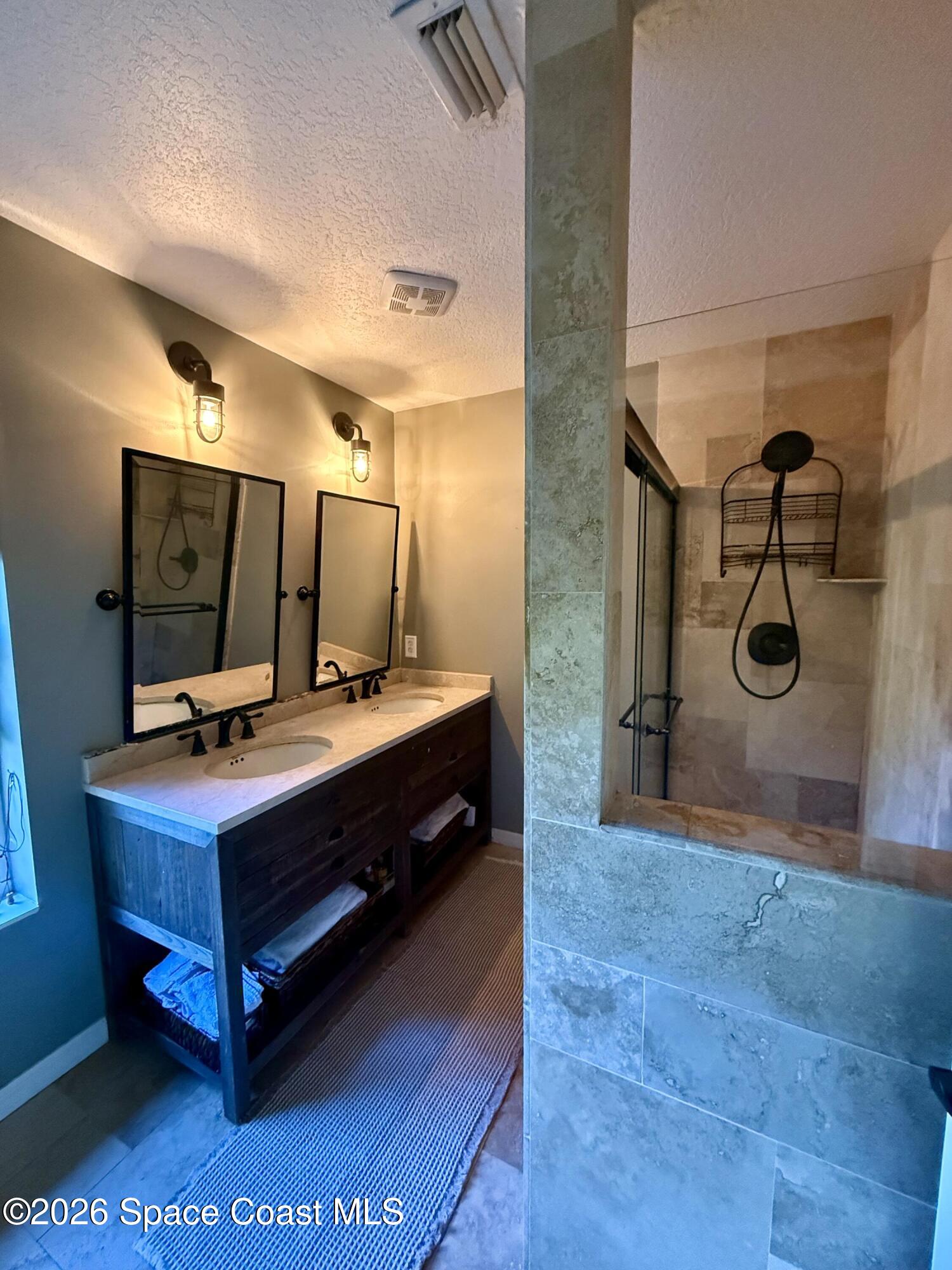 111 Seagrape Road Melbourne Beach, FL 32951 - Photo 5 of 19 a room with a table and a projector screen