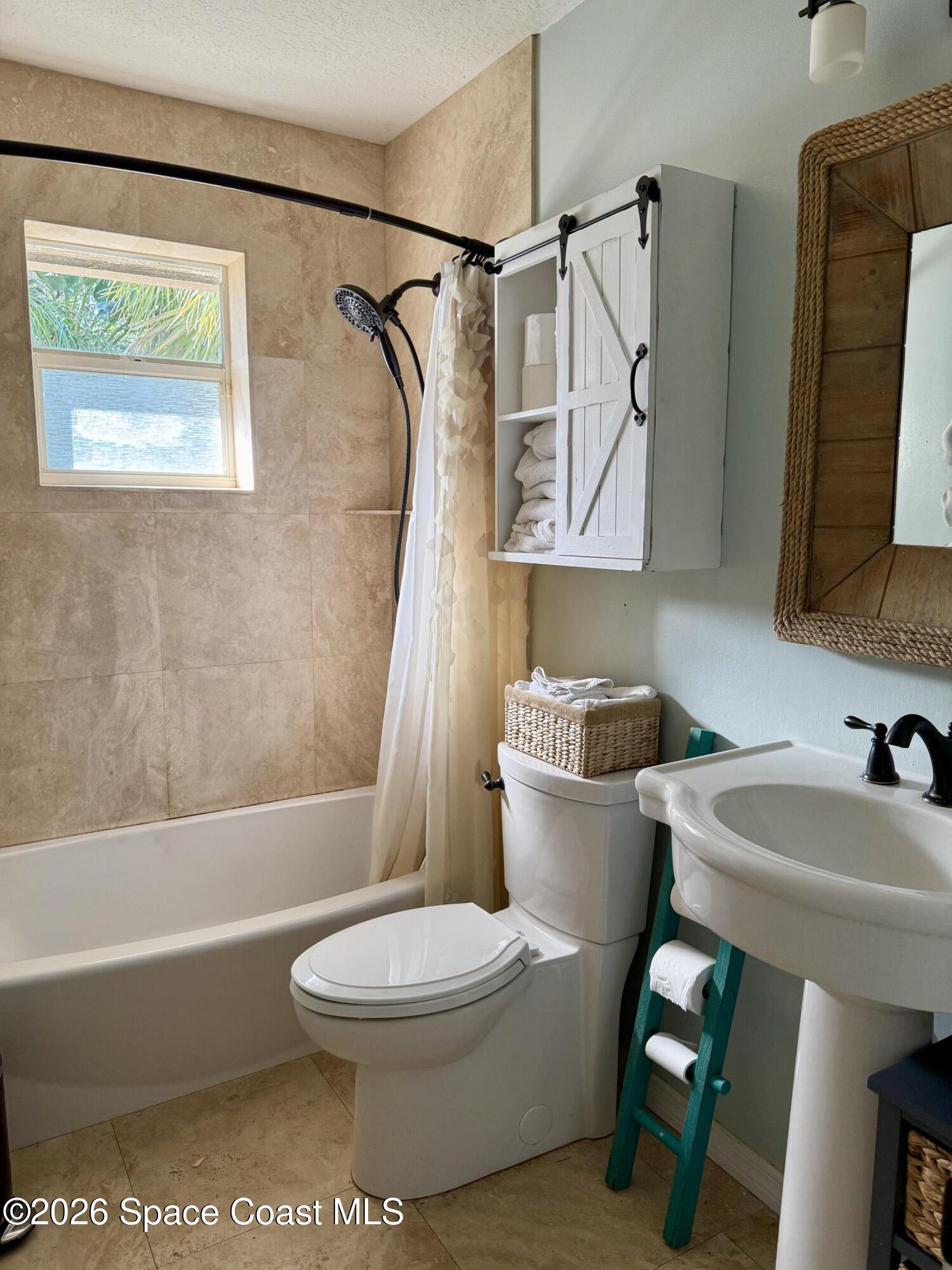 111 Seagrape Road Melbourne Beach, FL 32951 - Photo 7 of 19 a bathroom with a sink toilet and shower