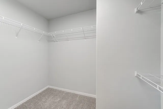 a view of a room with shelf on the wall