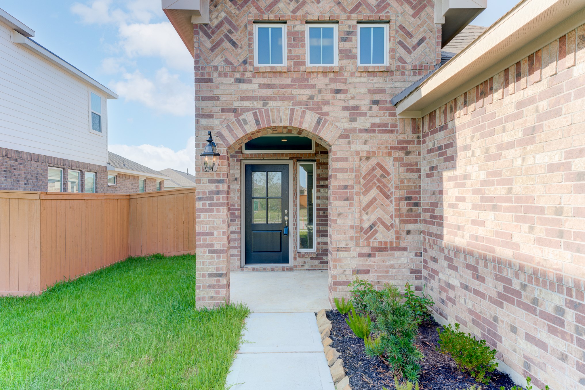 1225 Red Hills Drive Rosharon, TX 77583 - Photo 3 of 27 a front view of a house with garden