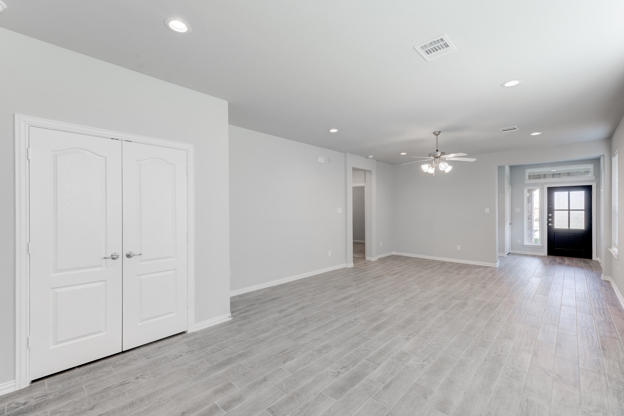 1225 Red Hills Drive Rosharon, TX 77583 - Photo 8 of 27 an empty room with wooden floor and windows