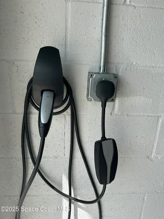 a bedroom with a bed and a ceiling fan