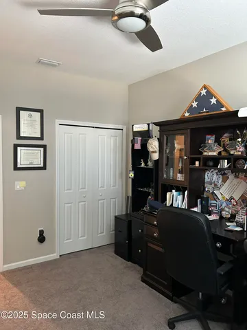 a living room with lots of furniture and a chandelier
