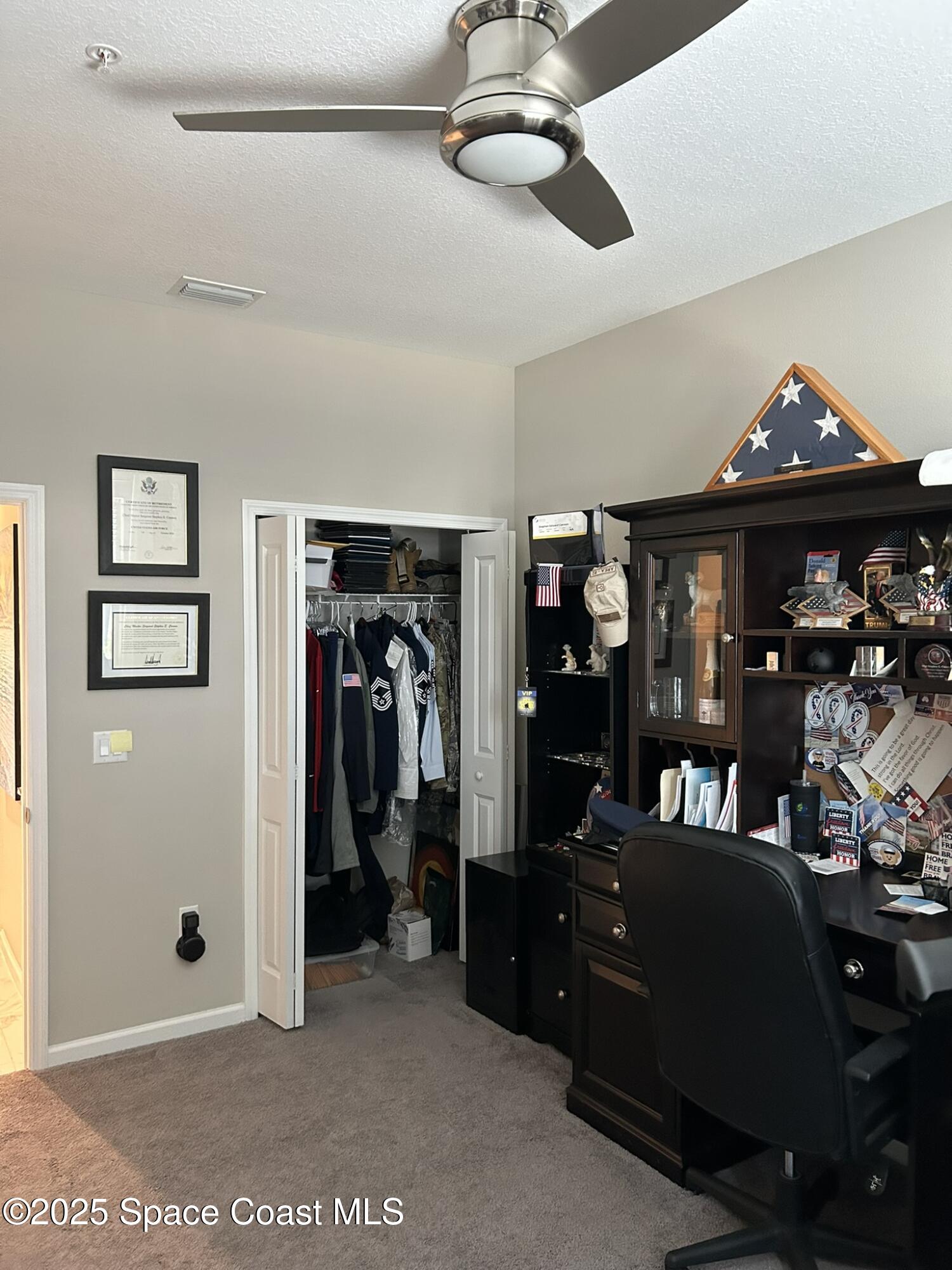 3931 Playa Del Sol Drive, Unit 203 Rockledge, FL 32955 - Photo 17 of 36 a living room with lots of furniture and a chandelier