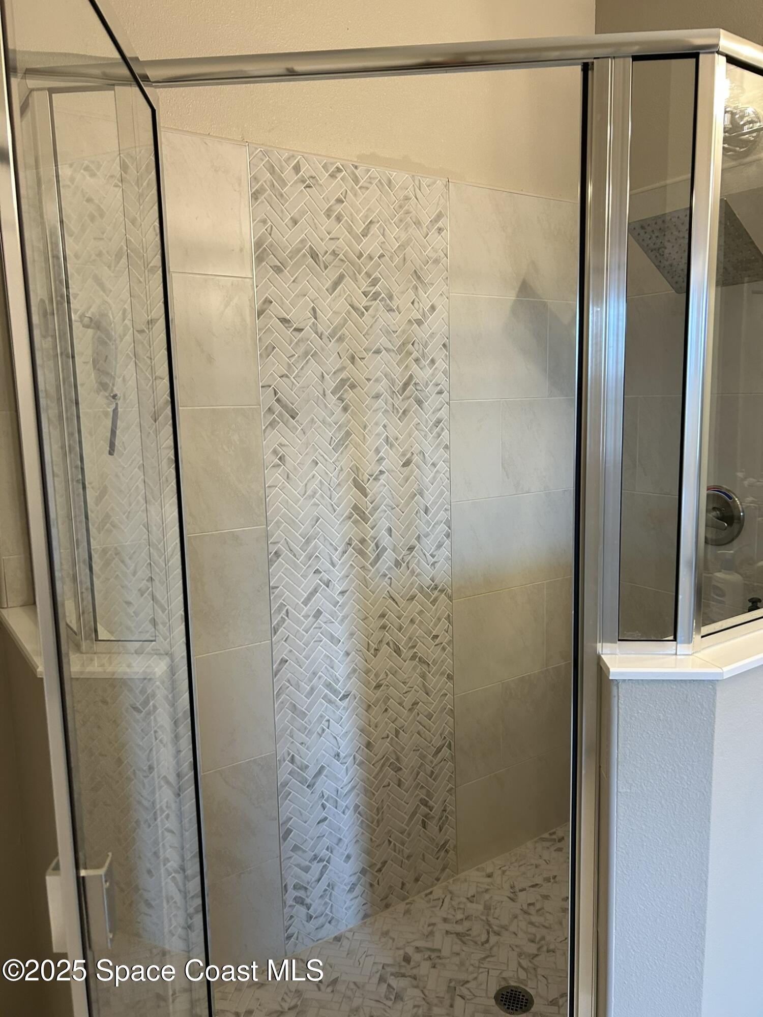 3931 Playa Del Sol Drive, Unit 203 Rockledge, FL 32955 - Photo 21 of 36 a bathroom with a shower