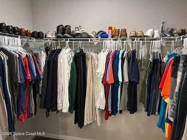 a bathroom with a granite countertop toilet sink and mirror