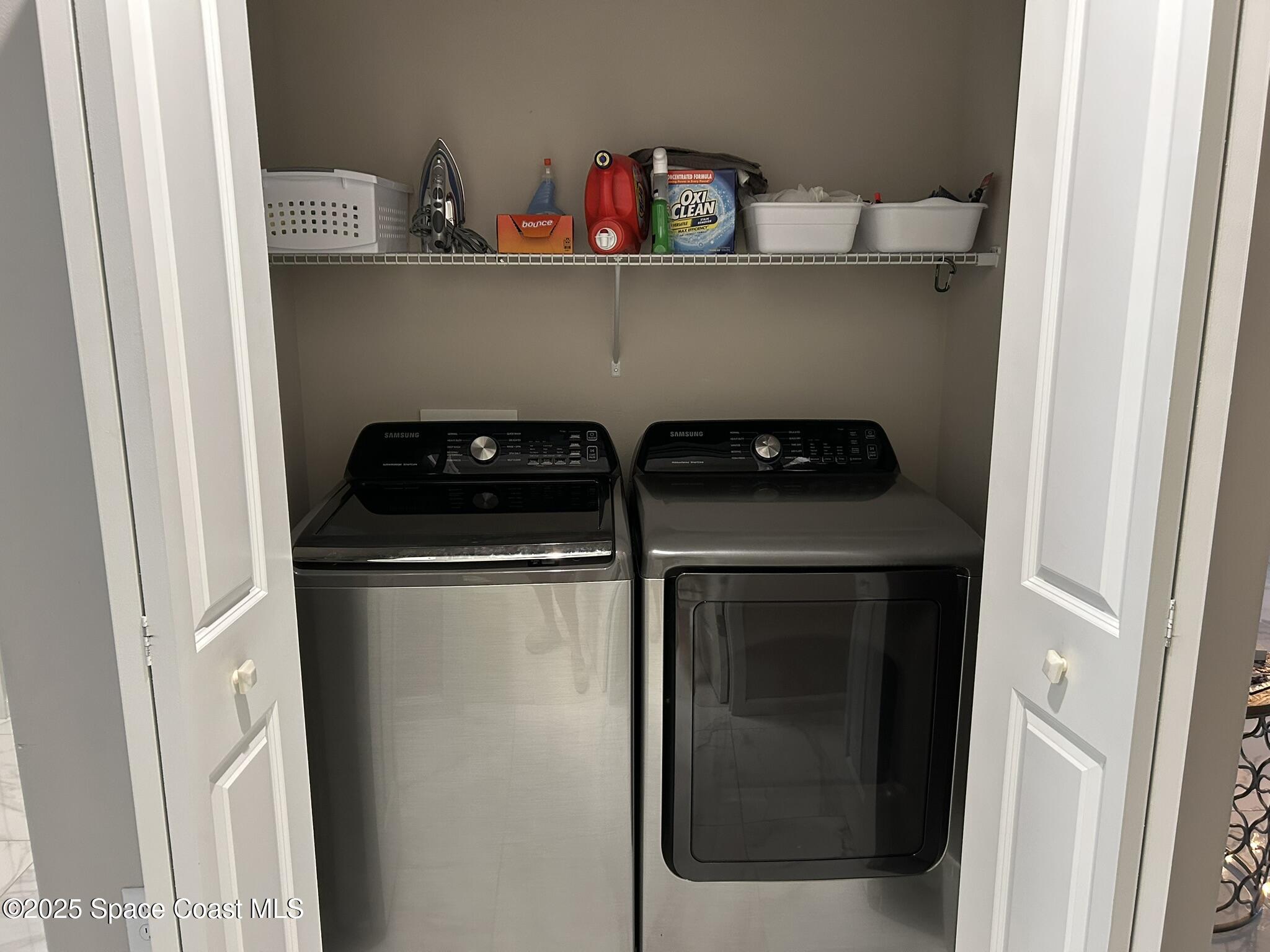 3931 Playa Del Sol Drive, Unit 203 Rockledge, FL 32955 - Photo 24 of 36 a close view of washer and dryer