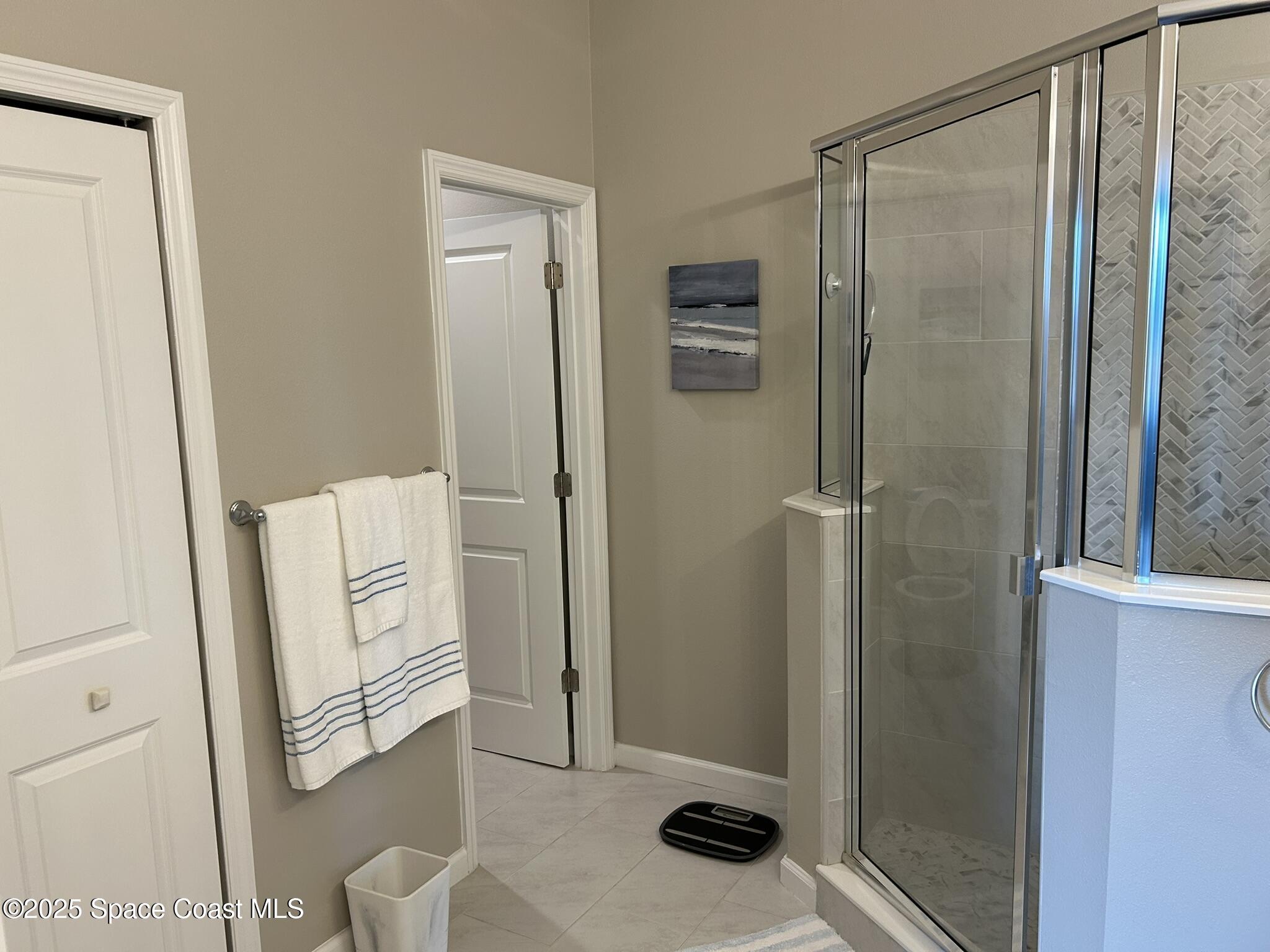 3931 Playa Del Sol Drive, Unit 203 Rockledge, FL 32955 - Photo 26 of 36 a bathroom with a shower and toilet