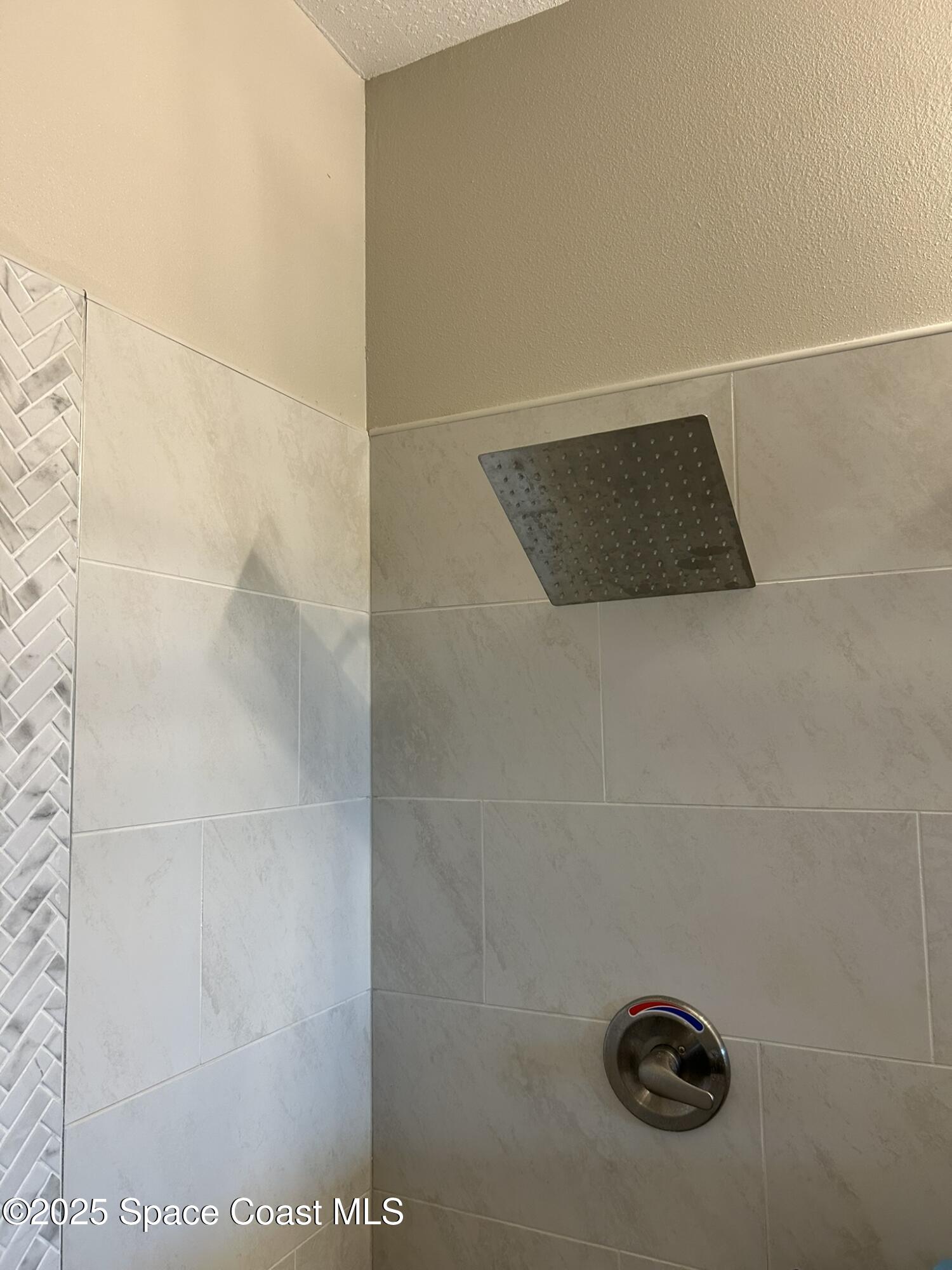 3931 Playa Del Sol Drive, Unit 203 Rockledge, FL 32955 - Photo 28 of 36 a bathroom with a shower