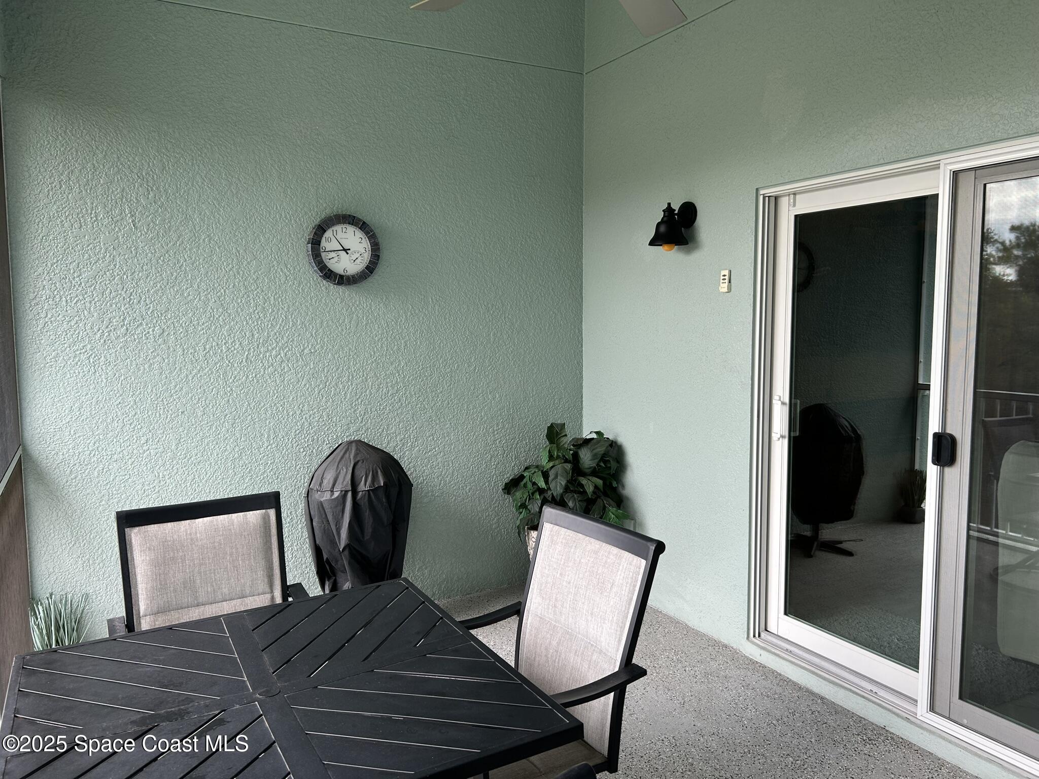 3931 Playa Del Sol Drive, Unit 203 Rockledge, FL 32955 - Photo 29 of 36 a view of a livingroom with furniture and wooden floor