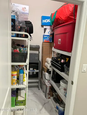 a view of a workspace with bookshelf