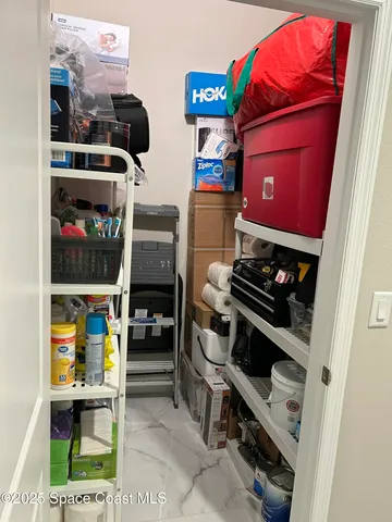 a view of a workspace with bookshelf
