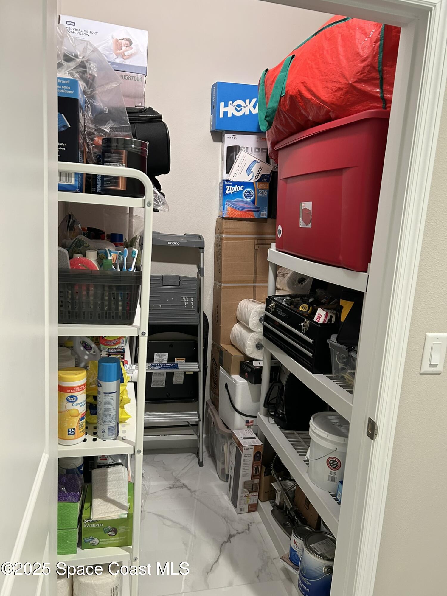3931 Playa Del Sol Drive, Unit 203 Rockledge, FL 32955 - Photo 30 of 36 a kitchen with stainless steel appliances and cabinets