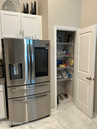a kitchen with appliances and cabinets