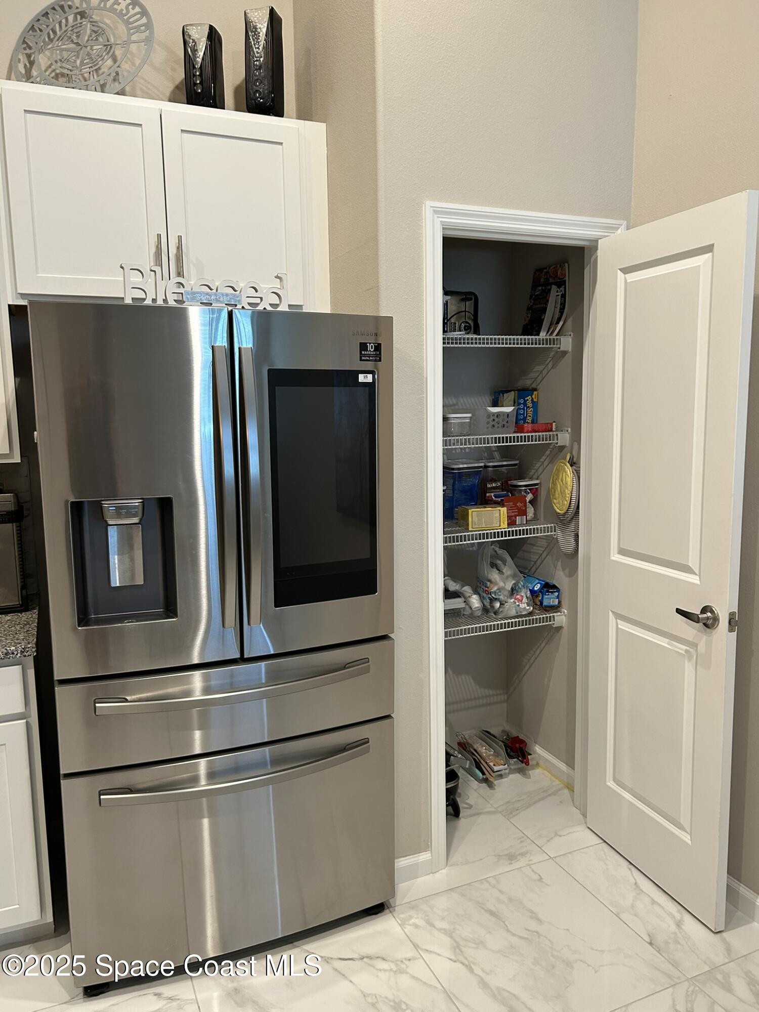 3931 Playa Del Sol Drive, Unit 203 Rockledge, FL 32955 - Photo 10 of 36 a kitchen with appliances and cabinets