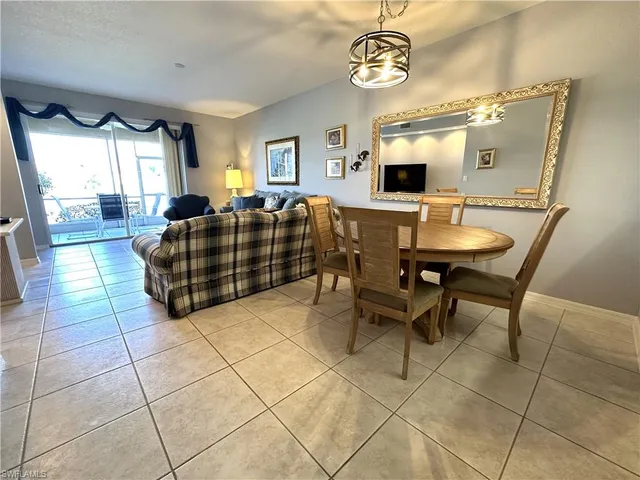a view of a livingroom with furniture window and wooden floor