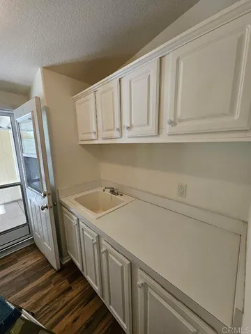 a view of a hallway with washer and dryer
