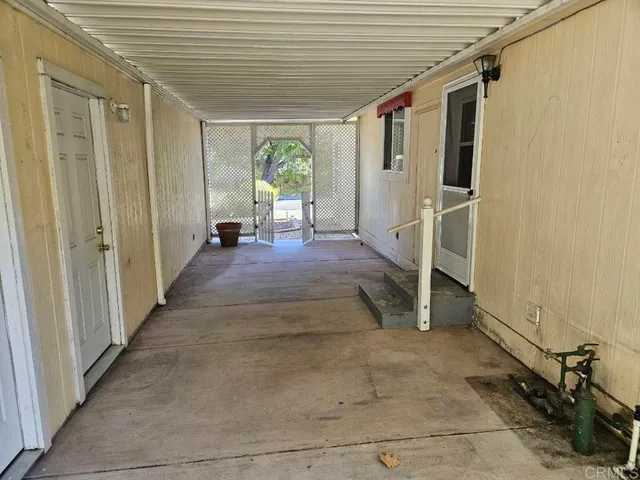 a view of a porch with seating space