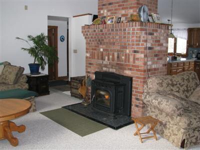 9 Josephs Road Truro, MA 02666 - Photo 10 of 14 a living room with furniture and a fireplace