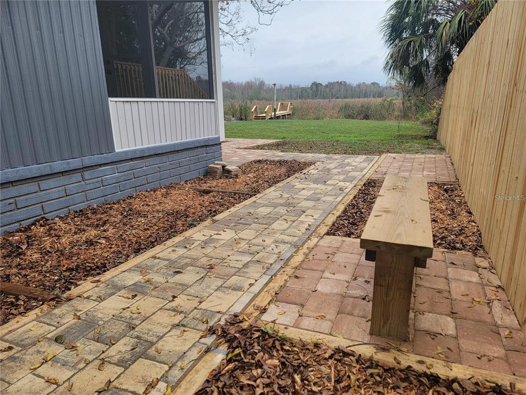 10895 Southeast Timucuan Road Summerfield, FL 34491 - Photo 18 of 23 a view of a back yard of the house