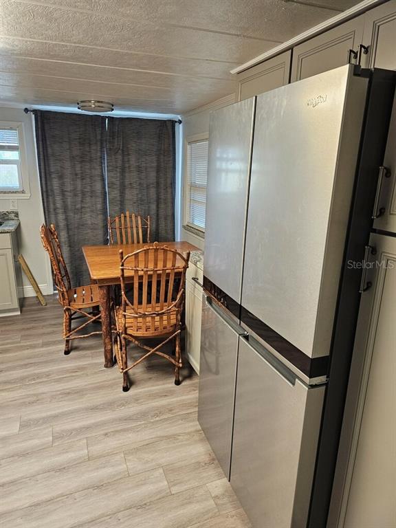 10895 Southeast Timucuan Road Summerfield, FL 34491 - Photo 9 of 23 a bedroom with a bed and a mirror