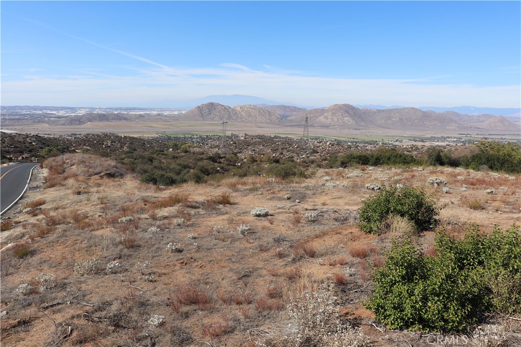 22990 Maclean Ranch Homeland, CA 92548 - Photo 16 of 26 a view of a forest with mountains in the background