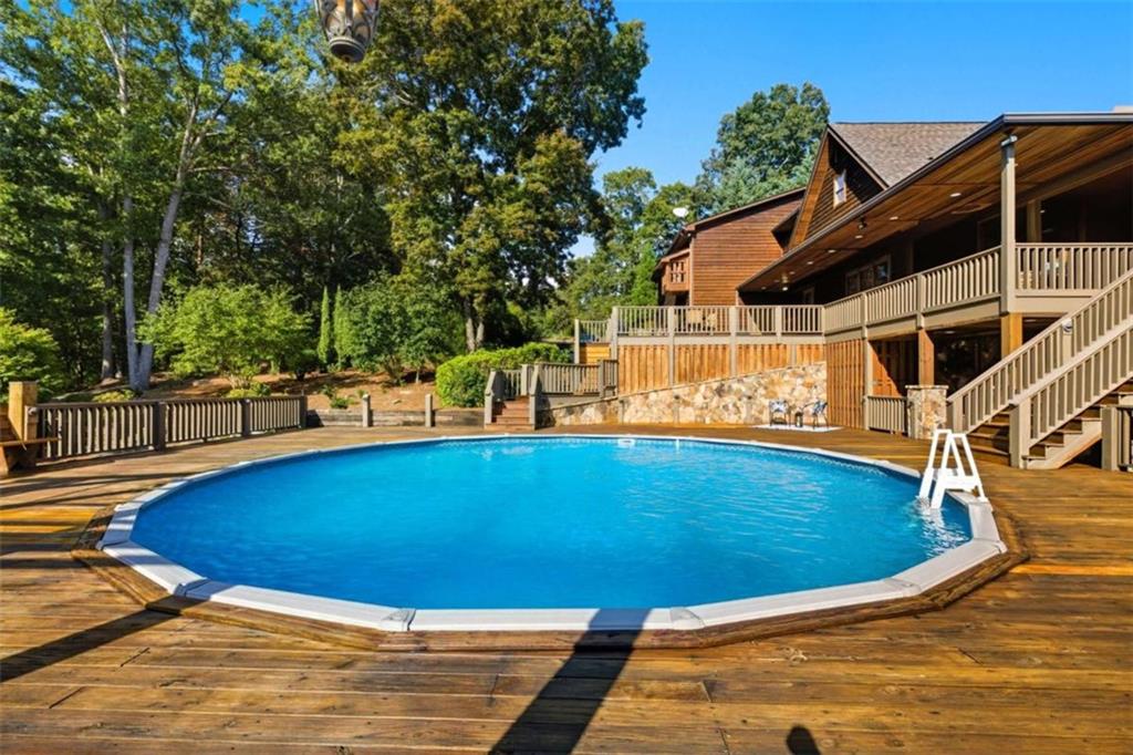 1091 Echota Road Clarkesville, GA 30523 - Photo 63 of 89 a view of a swimming pool with an outdoor space