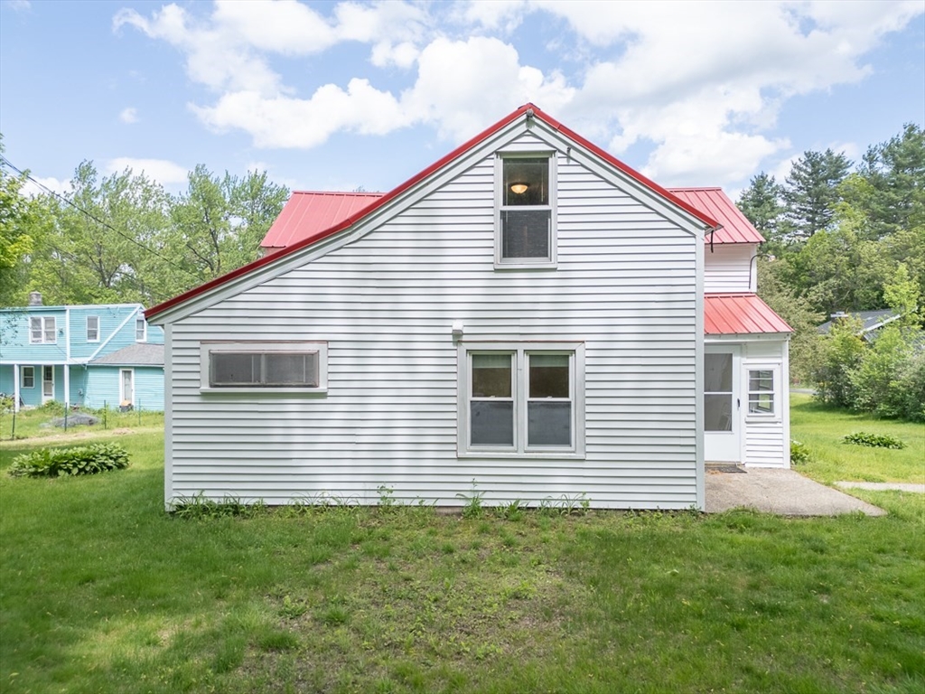 92 Squannacook Road Shirley, MA 01464 - Photo 2 of 38 a front view of a house with a yard