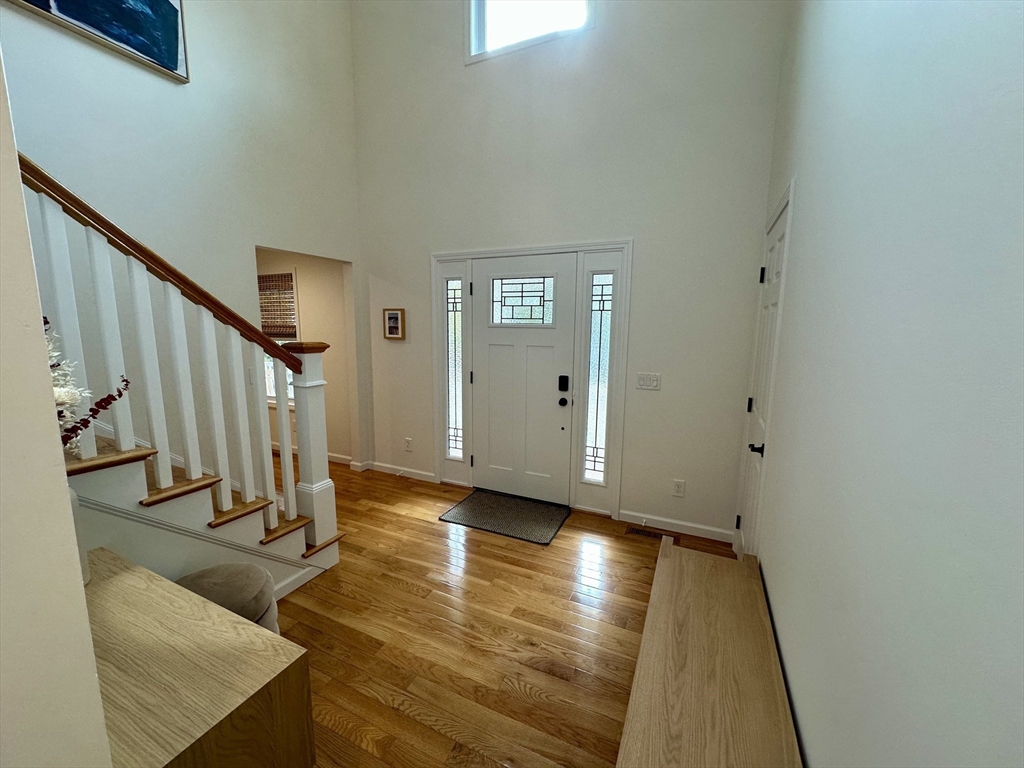 151 Tashmoo Avenue Tisbury, MA 02568 - Photo 16 of 28 a view of a hallway with wooden floor and staircase