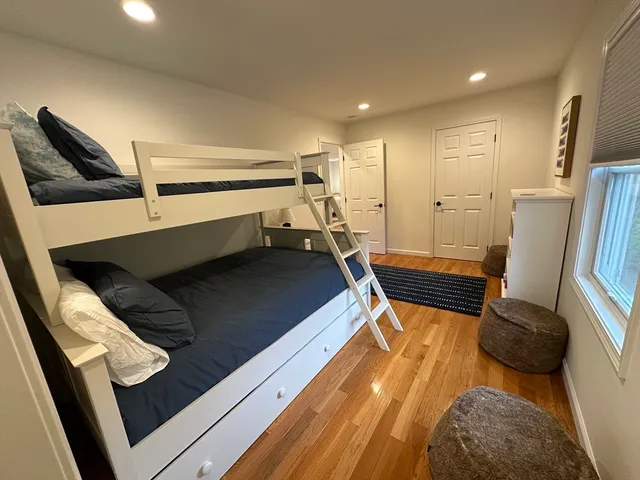 a bedroom with a bed and furniture