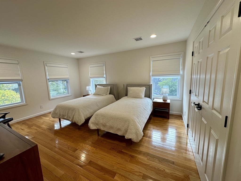 151 Tashmoo Avenue Tisbury, MA 02568 - Photo 26 of 28 a bedroom with double bed and a large window