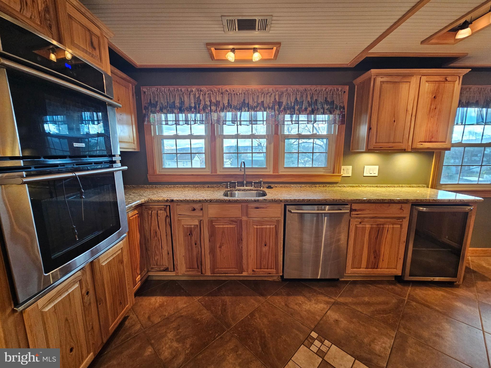 615 Villa Avenue, Unit A Front Royal, VA 22630 - Photo 18 of 29 a kitchen with stainless steel appliances granite countertop a stove a sink and a microwave