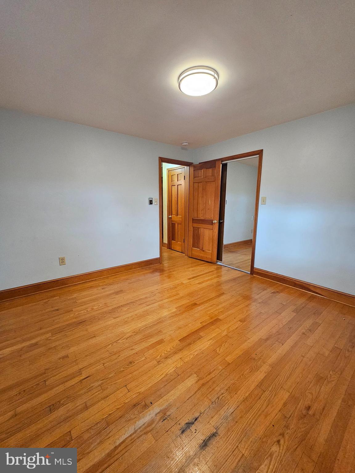 615 Villa Avenue, Unit A Front Royal, VA 22630 - Photo 26 of 29 a view of an empty room with window and wooden floor