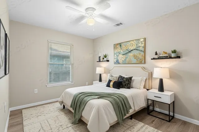 a bedroom with a bed and a window