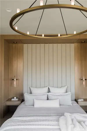 a spacious en suite bathroom with a double vanity sink a mirror and a bathtub