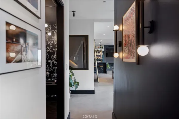 a bedroom with a bed and glass door