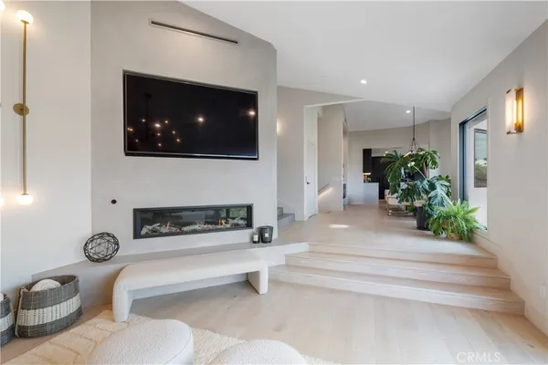 a kitchen with a sink a counter space appliances and cabinets