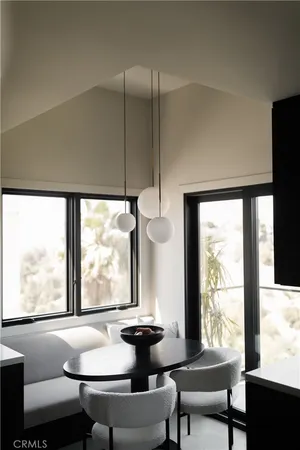 a view of a room with furniture and window