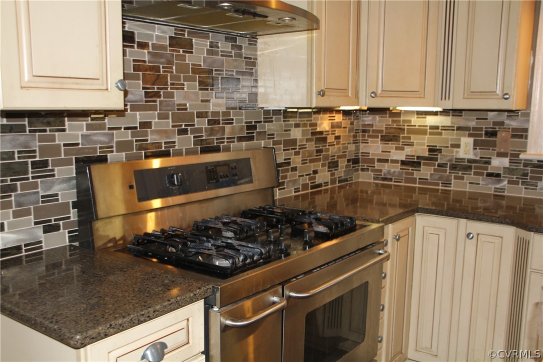 1631 Johnson Road Petersburg, VA 23805 - Photo 2 of 4 a kitchen with a sink stove and cabinets