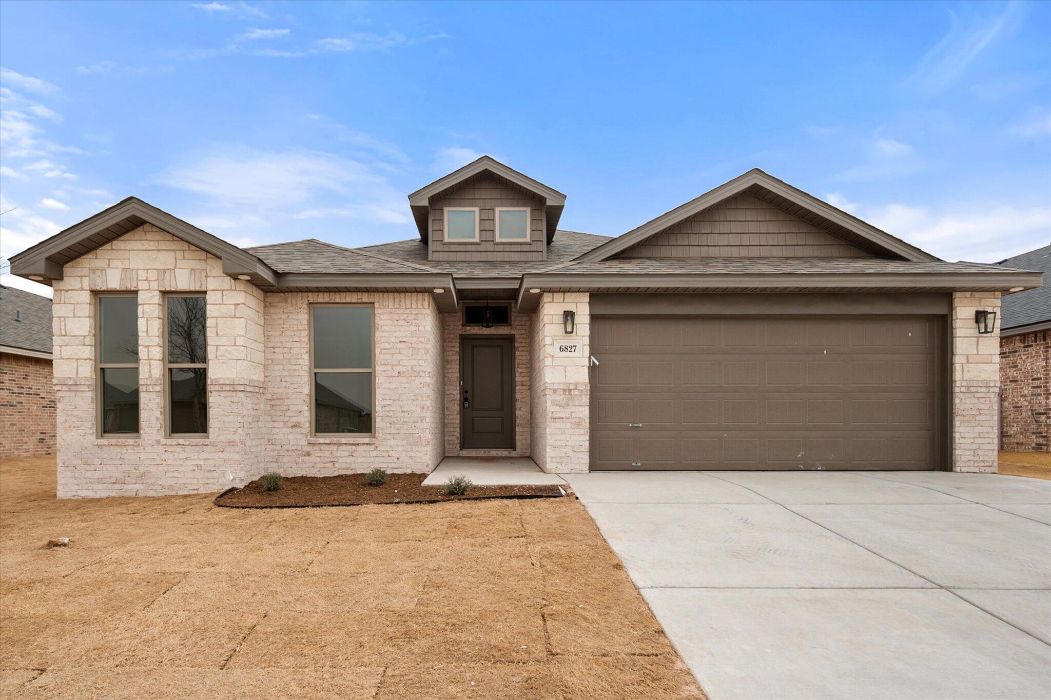 a front view of a house with yard