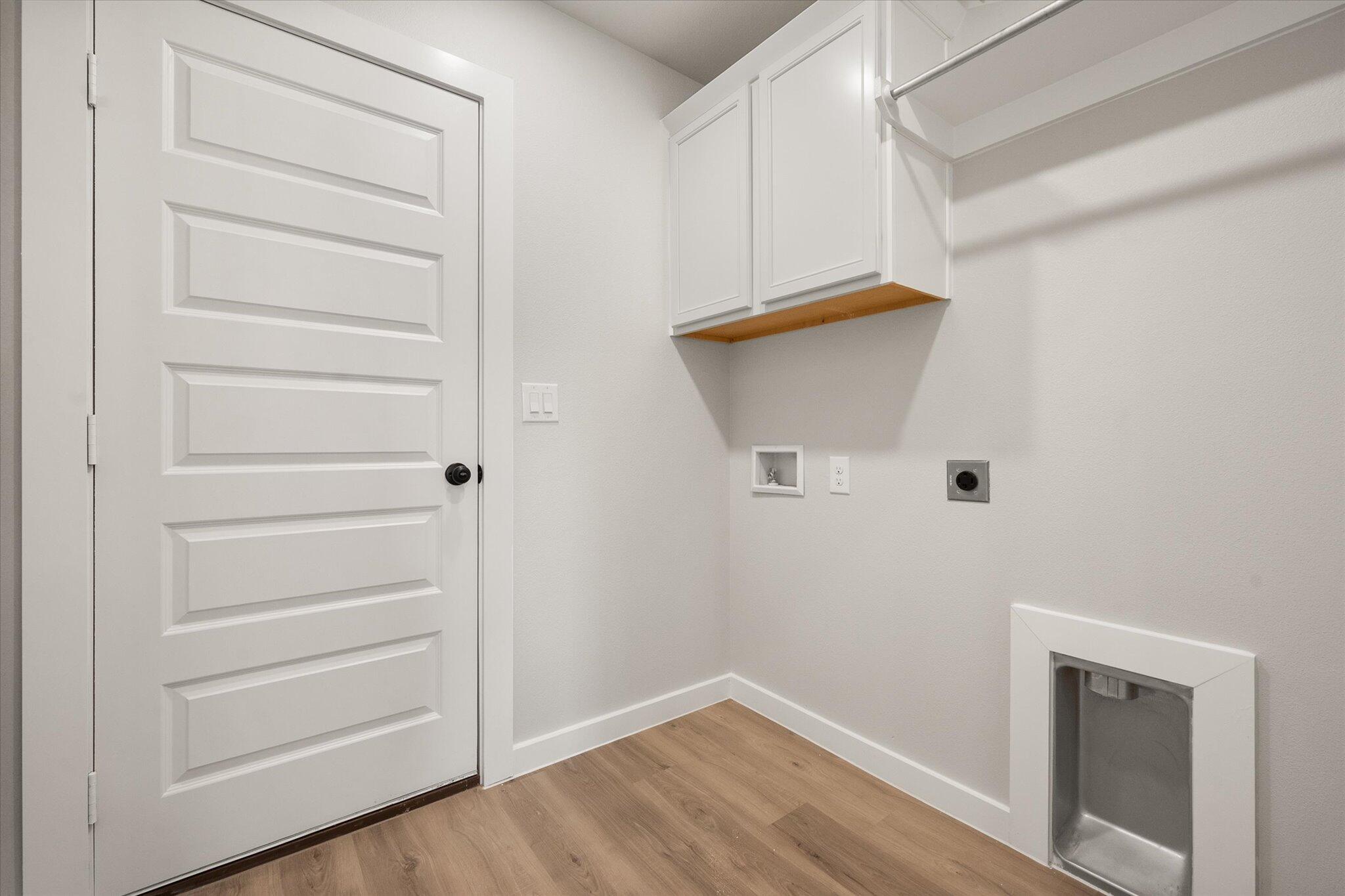 6827 54th Street Lubbock, TX 79407 - Photo 22 of 23 a view of walk in closet with empty racks