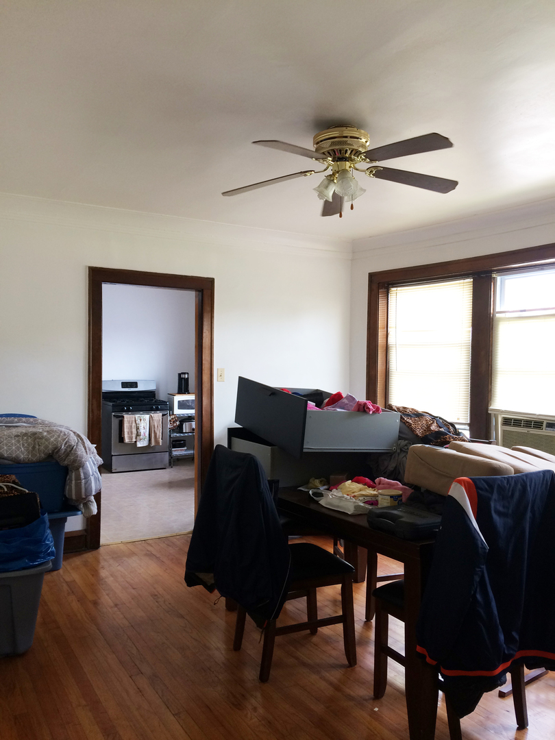 11432 South Indiana Avenue Chicago, IL 60628 - Photo 12 of 21 a living room with furniture and a window