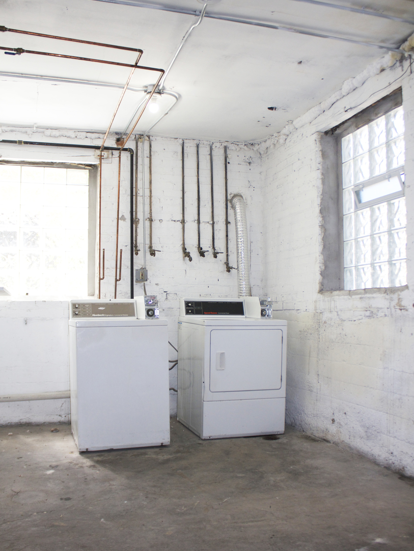 11432 South Indiana Avenue Chicago, IL 60628 - Photo 16 of 21 a room with cabinets and a window