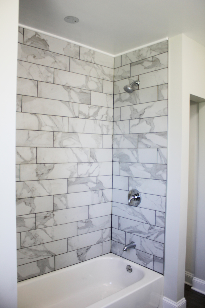 11432 South Indiana Avenue Chicago, IL 60628 - Photo 8 of 21 a bathroom with a bathtub