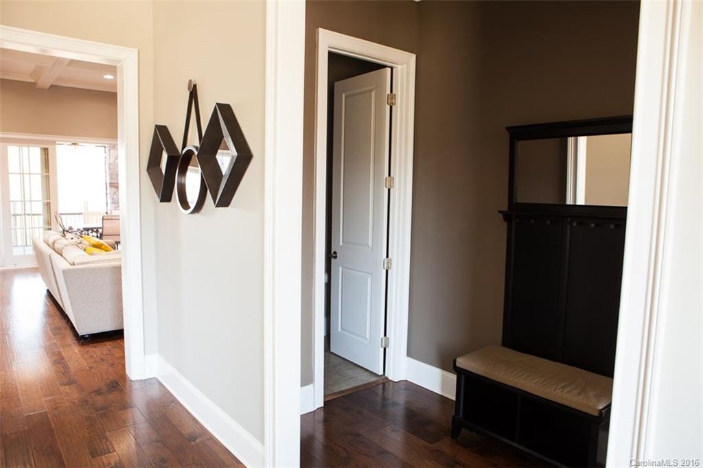 792 Harvest Pointe Drive Fort Mill, SC 29708 - Photo 13 of 24 a hallway with wooden floor and windows